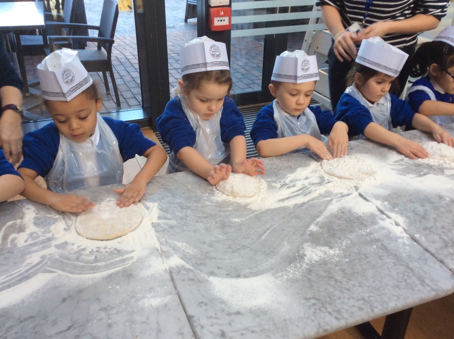 Flattening the dough.