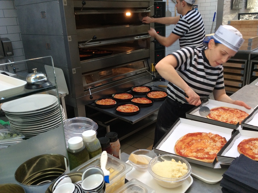 Slicing the pizza.