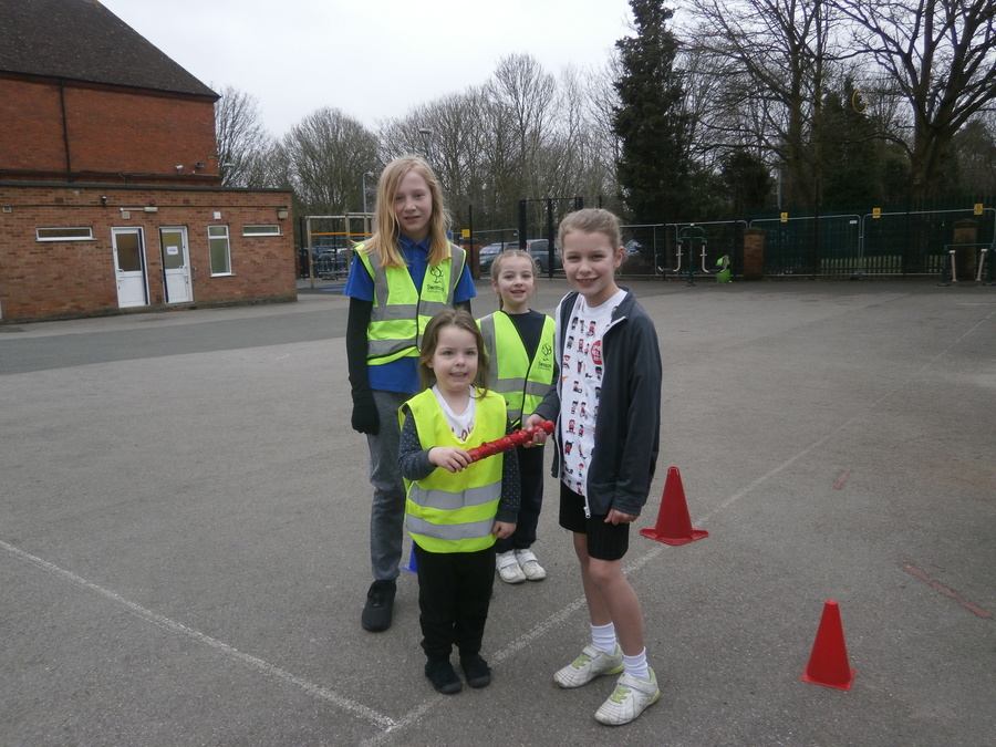 The youngest child, the eldest child and the middle child ran the first leg of the school to school relay. At Lethbridge they handed over the baton.