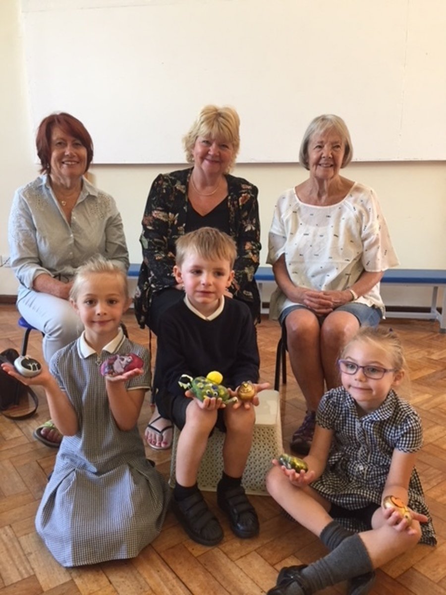 Winners of the pebble painting competition with members of the Women In Touch group. Winners of the pebble painting competition with members of the Women In Touch group.