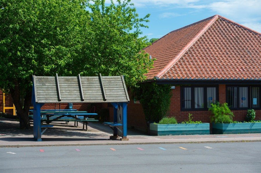 Our playground and modern school building built in the 1980s