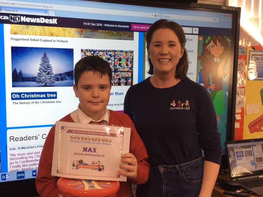 Max received his certificate and prize from Amelia from C2K Newsdesk