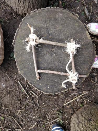 Amelia used a clove hitch to make a bird feeder and worked hard at creating her square. 