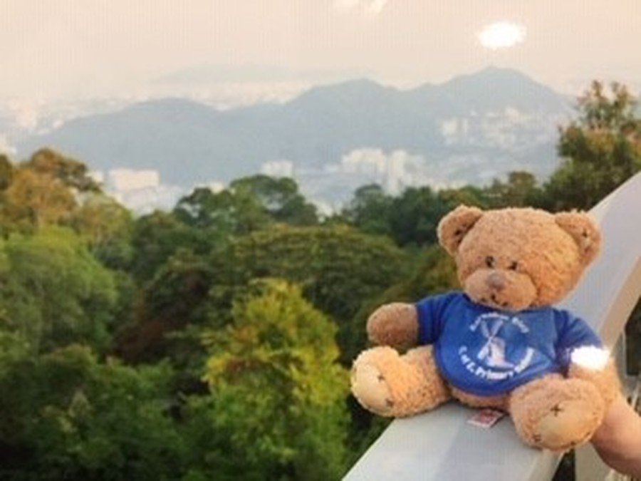 Enjoying the view from top of the Sky Walk at Penang Hill in George Town, Penang, Malaysia.