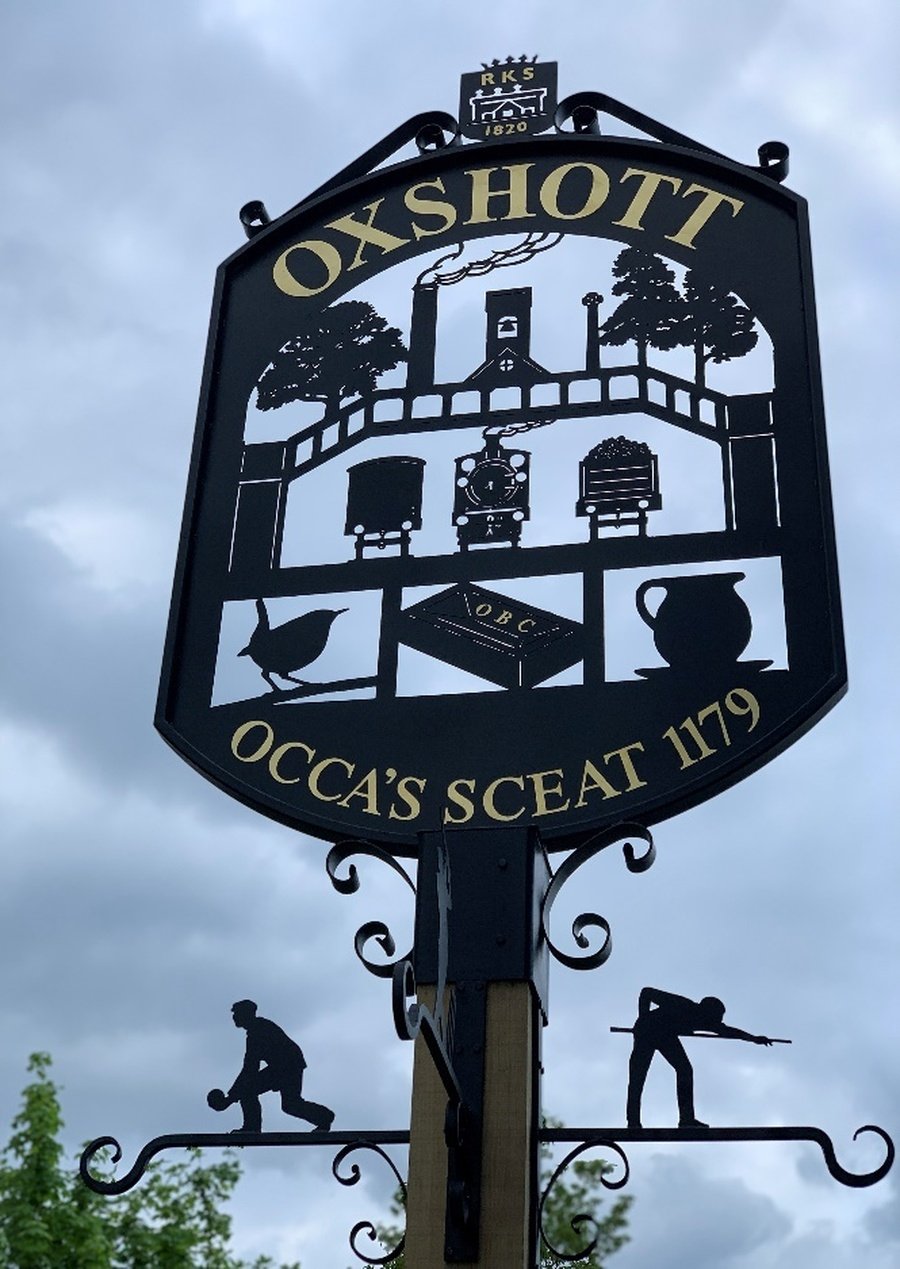 The Oxshott village sign featuring Royal Kent School, May 2019