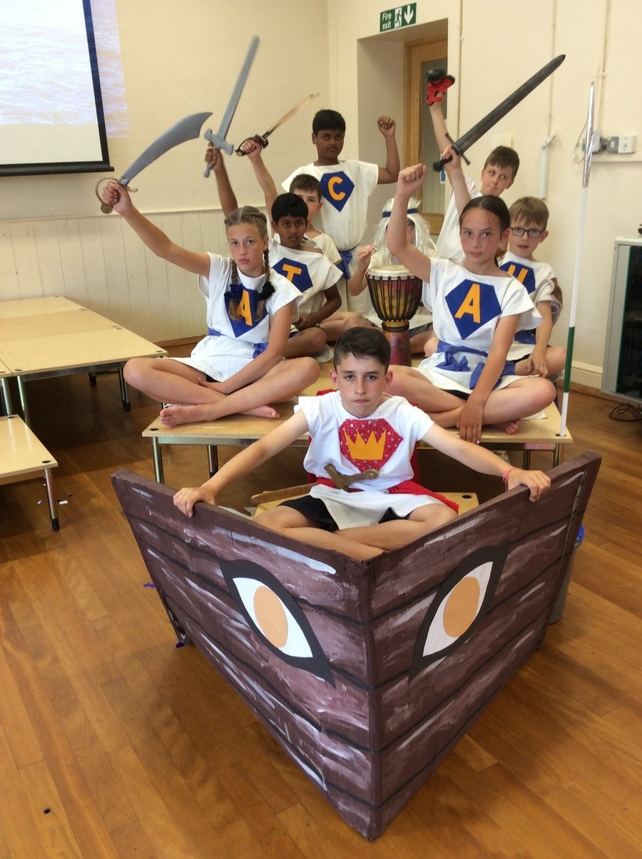 The crew of Argonauts began their voyage by raising their fists in honour to the gods.