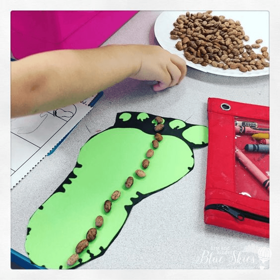 Draw around your foot and cut it out. Can you measure it using different objects in your house? Can you find someone in your house who has a bigger foot? What do you think the giant's foot would look like?