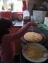 Alicia making pizza