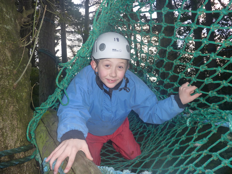 Tiernan crawls through the net, smiling and giggling all the way!