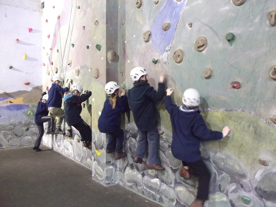 Miss Tumilty's group try the lower challenge on the climbing wall.