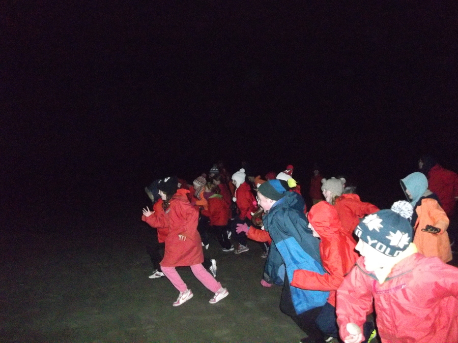 Racing in the dark on the beach walk.  On your marks, get set go!