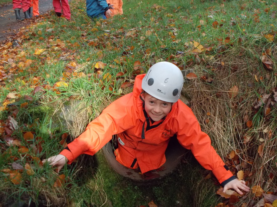 Matthew crawls through the first challenge on the adventure walk.