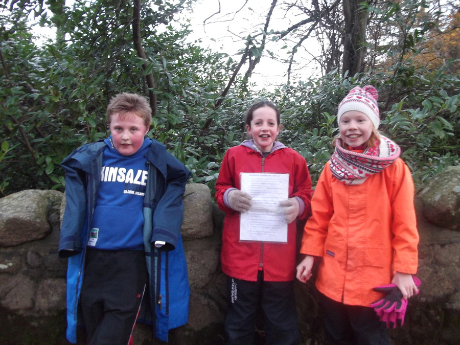 Daniel, Aidin and Emma searching for clues when orienteering in Castlewellan Park.