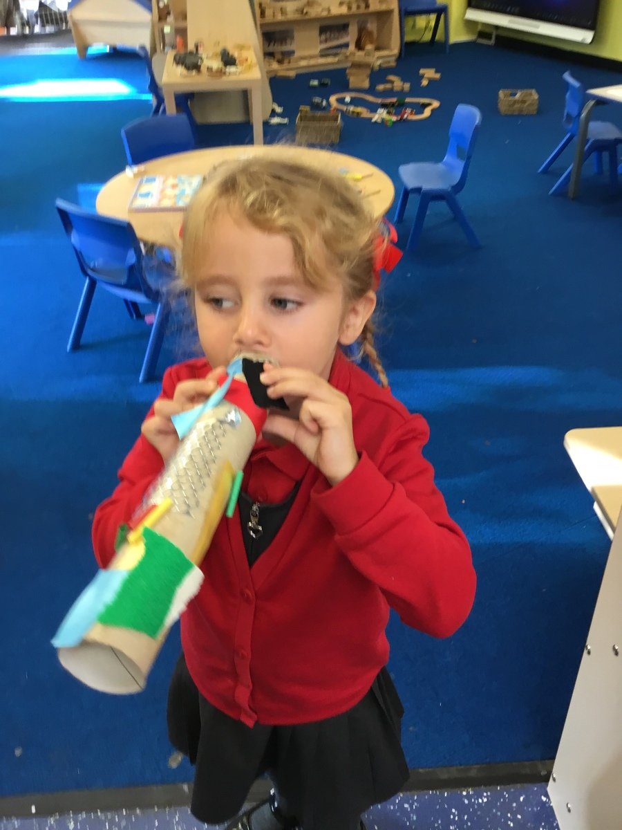 Ailya impressed us with  her trumpet. She was very proud of herself. Using and choosing the right kind of materials for her cutting and sticking activity