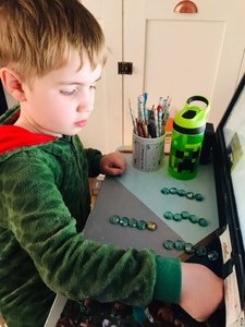 Jacob using resources for Maths