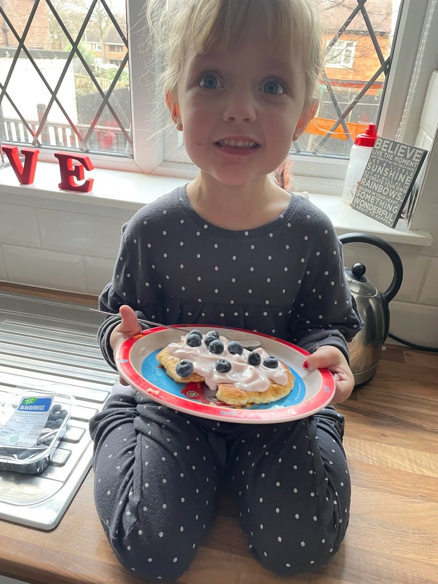 This is what Lexi was making a healthy lunch of pancakes with bananas and blueberries. Scrumptious