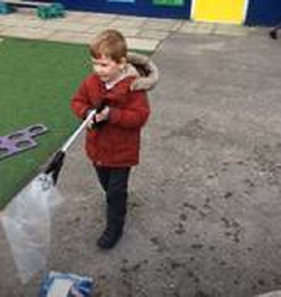 Early Years look at litter picking and discuss how to respect our environment.