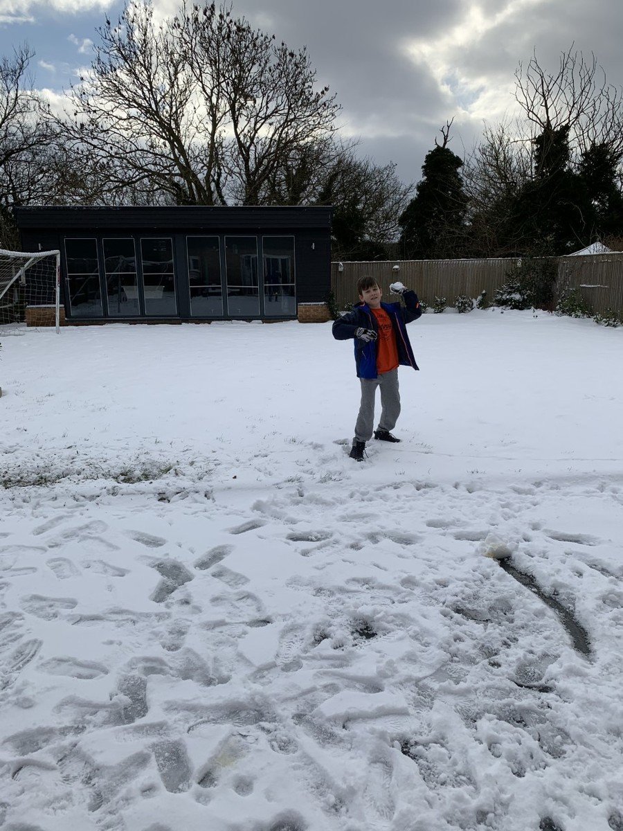 Having fun in the snow with mum.