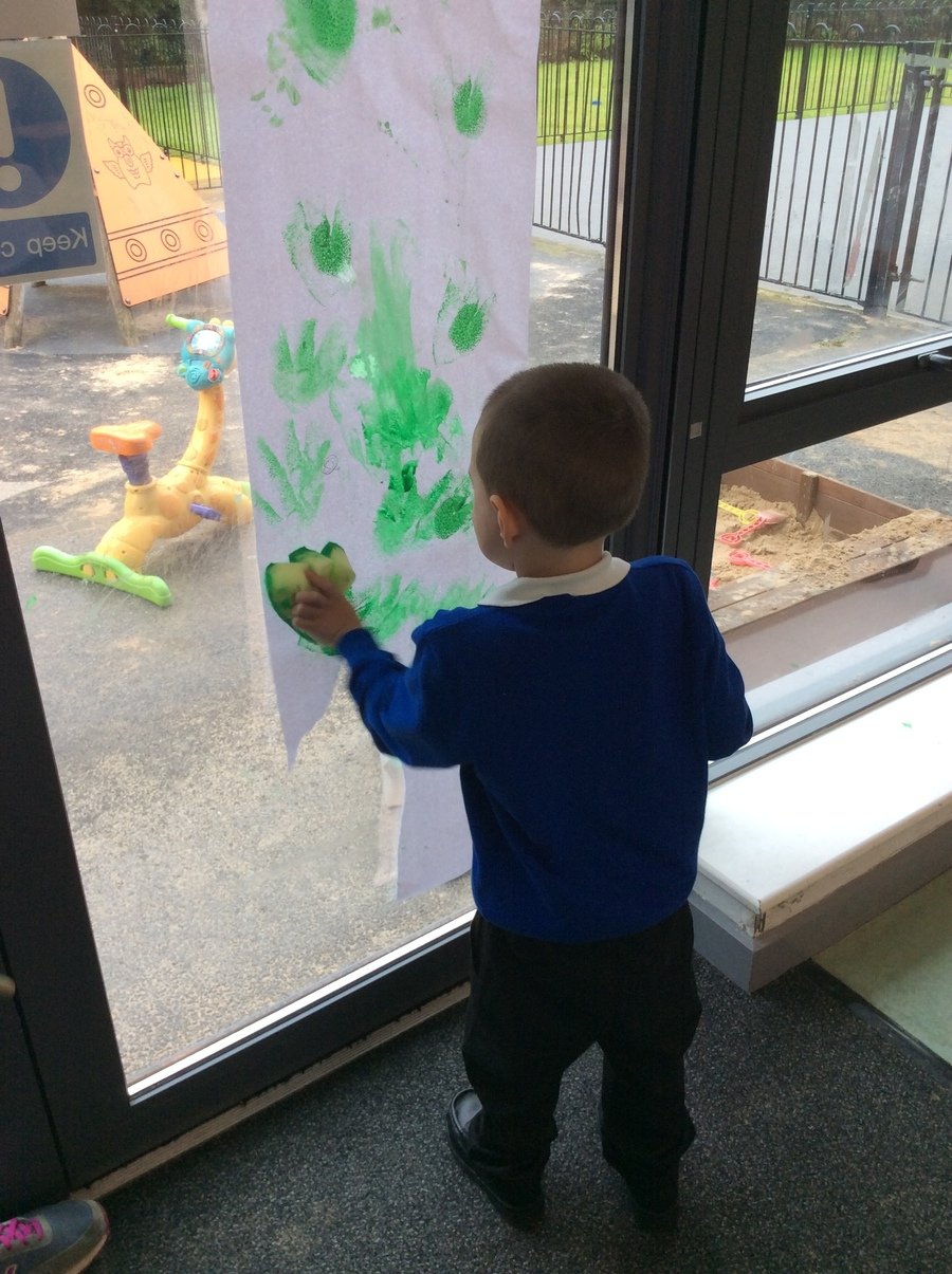 A, Year 1, Pathway 1 made dinosaur footprints and said "Stamp, stamp, stamp," as he did each footprint. He doesn't normally like getting messy so this is a fantastic achievement.