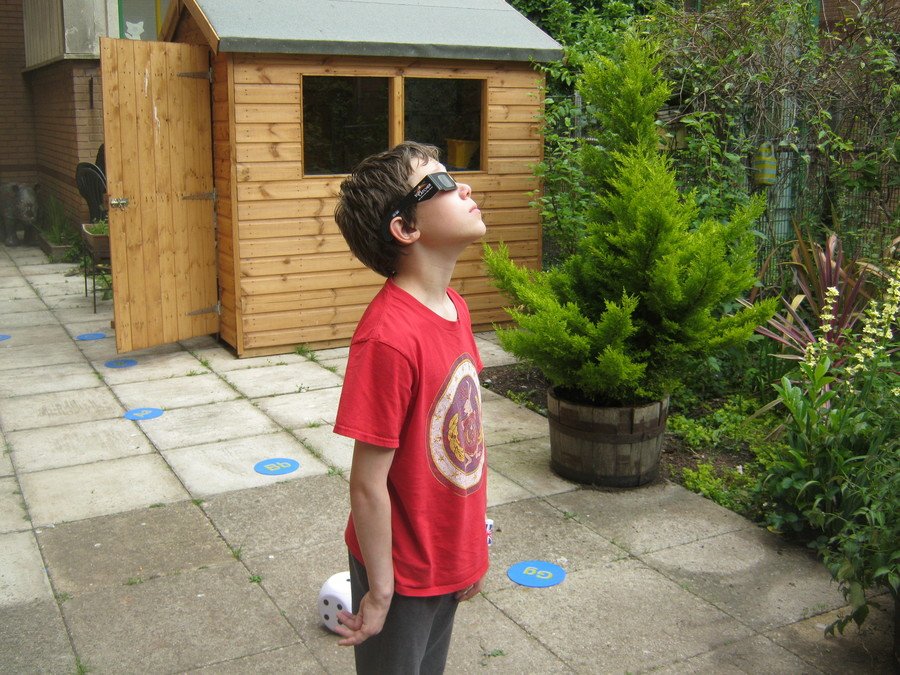 Noah observes the partial solar eclipse