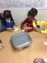 Ember, Rebecca and Jasmin making cakes from dough
