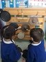 Early years enjoying their music wall 