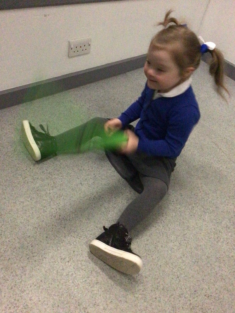 K, Year 1, pathway 1 making large arm movements during our wiggle writing session, she was waving her scarves side to side. 
