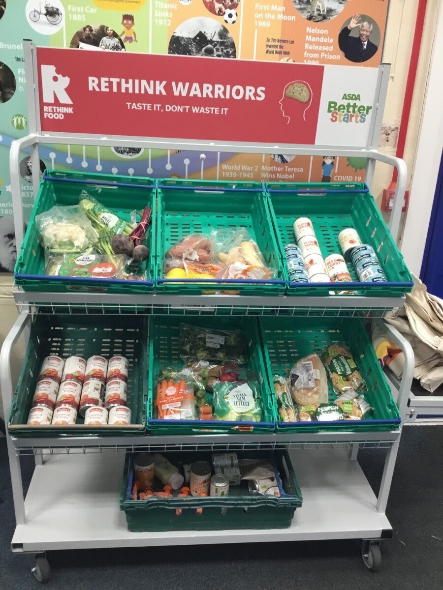 Our Rethink Food social enterprise is fully up and running! The Rethink Warriors designed our very own sign and slogan. Doesn’t it look professional? We receive surplus food from supermarkets like Marks and Spencers and Ocado. Every week our business is open on a Tuesday for one and all to access. Together we are eating to save the planet! A big thank you to Asda Morley for sponsoring this scheme and we are very grateful to Donna from Asda too for supporting us in setting up our very own Social Enterprise!
