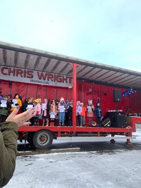 KS2 choir performing at the Guiseley Lights switch on