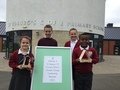 4 members of eco committee with eco challenge entries.JPG