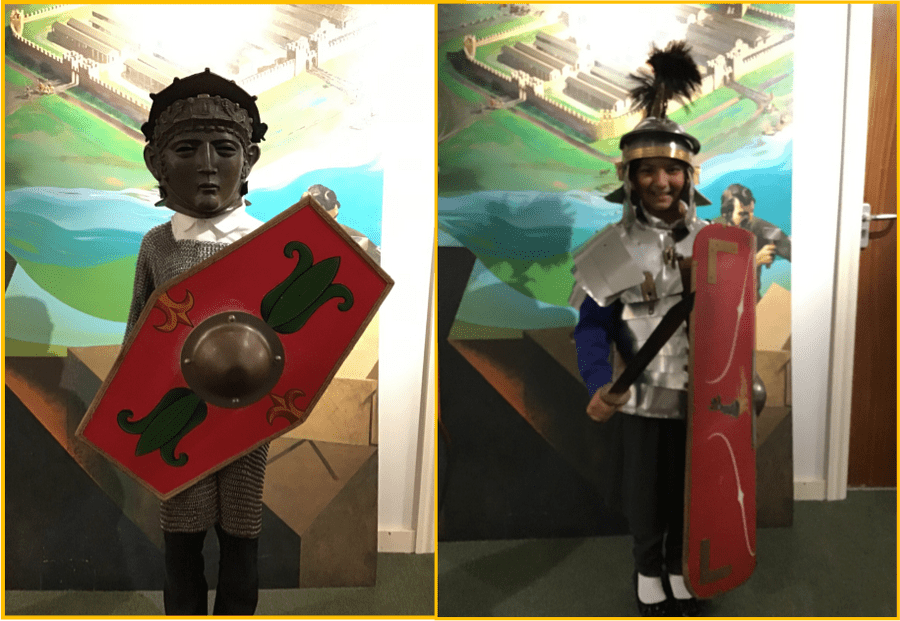 Year 4 children trying on Roman armour!