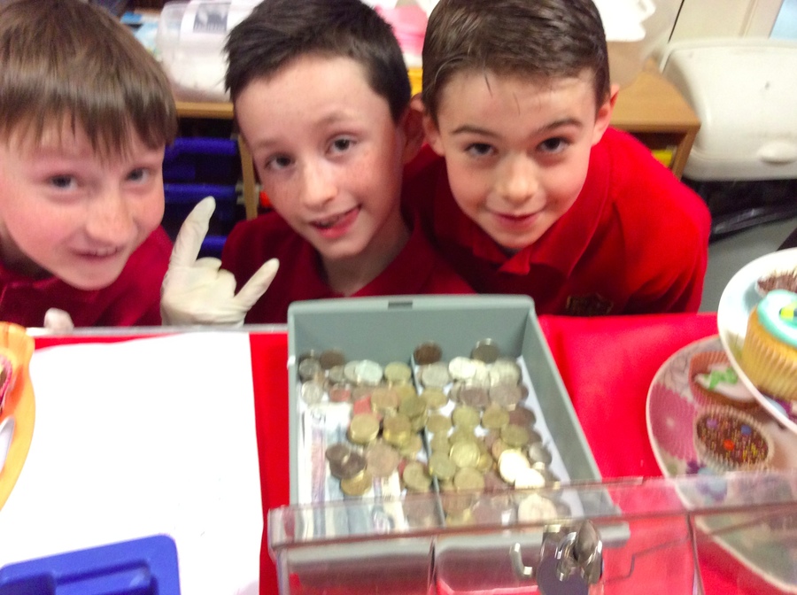 Harry, Callum and Adam were keen to count the cash to check out how much they stall was earning!