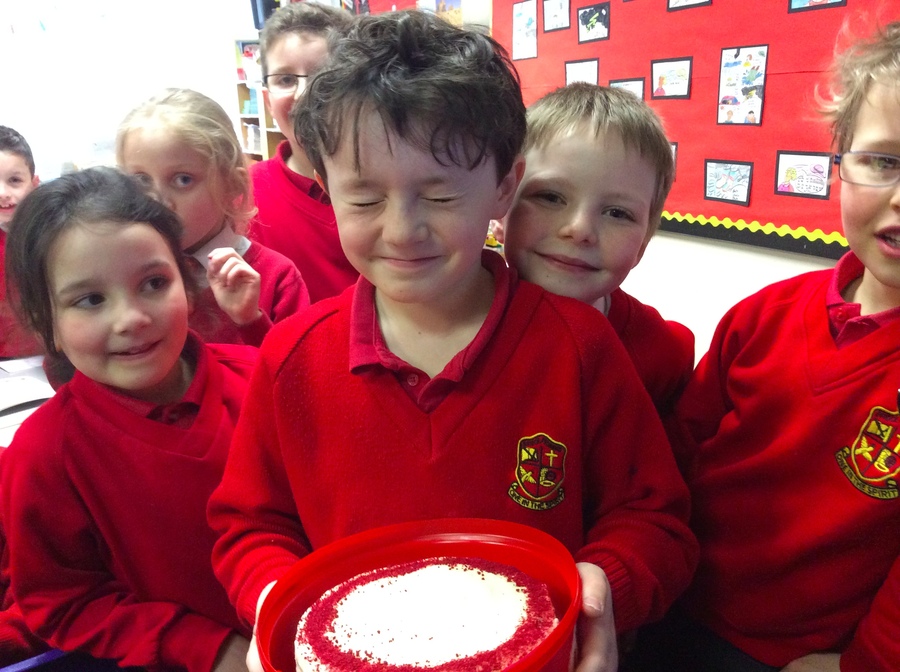 Eyes closed in excitement as the winner of Megan's cake gets a little embarrassed by the camera.