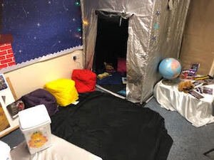 Look at our inviting rocket themed reading den!