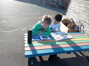 Year 3 relaxing with a book outside 13.jpg