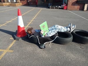 Year 3 relaxing with a book outside 4.jpg