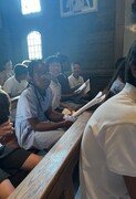 The choir singing at the parish International Mass