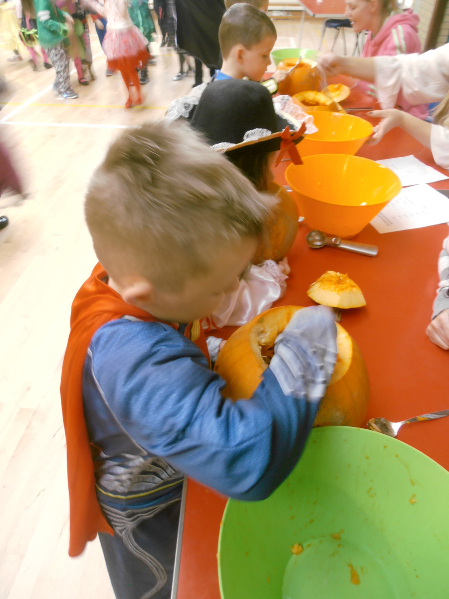 Reilly carving a pumpkin P.2D