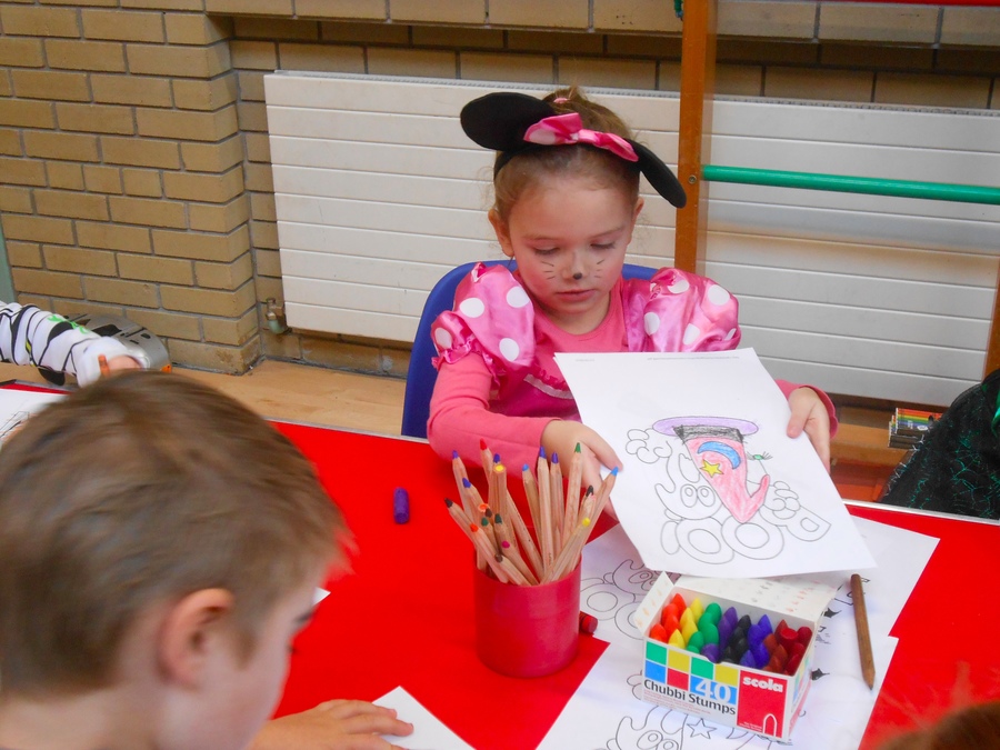 Maia in P.1 enjoys colouring in some spooky pictures.