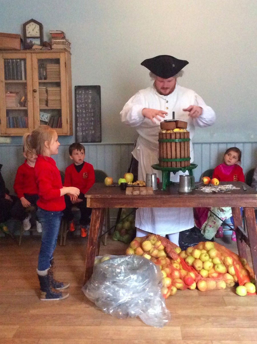 Zofia helps to press the apples