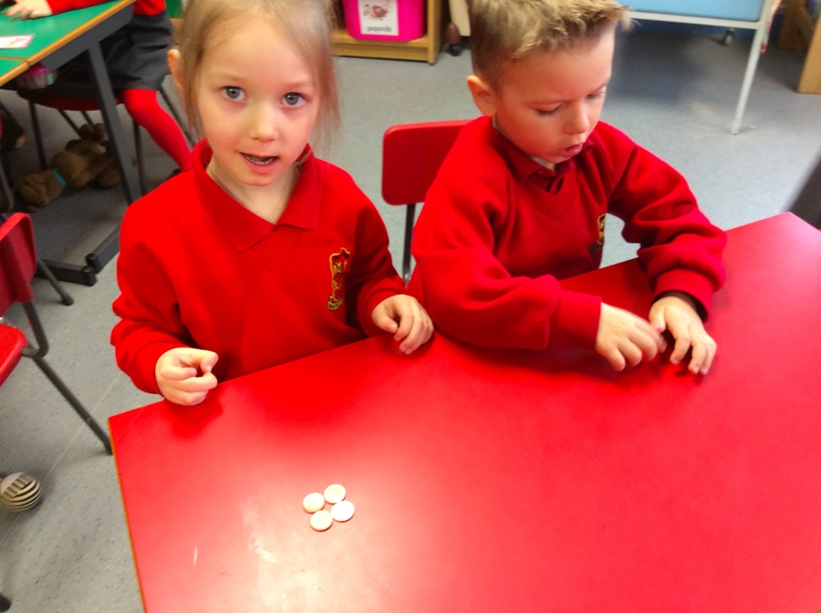 Grace counts out 4 pennies