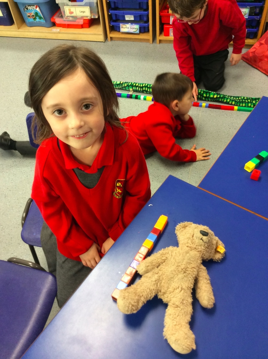 Cara P.2D measures her bear with cubes