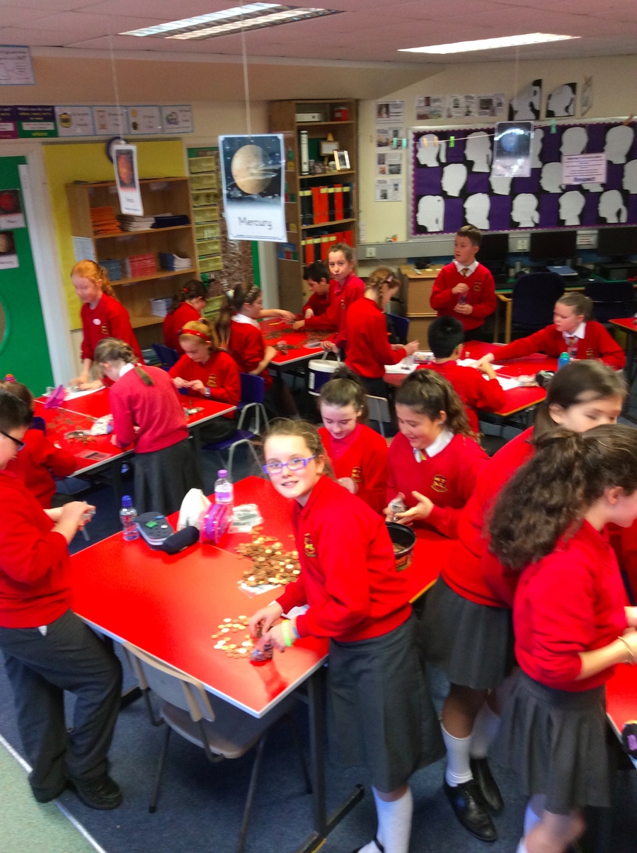 P.7YD are busy counting all the coins to find out the grand total