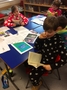 Joshua studying his favourite read.JPG