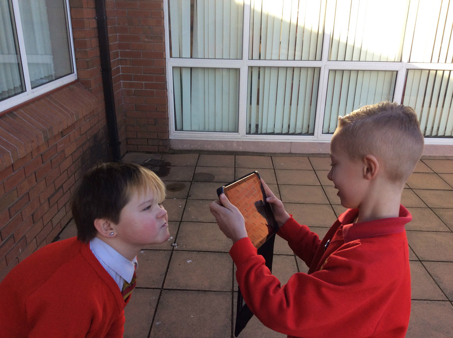 Calum taking an EXTREME CLOSE UP of Leon.