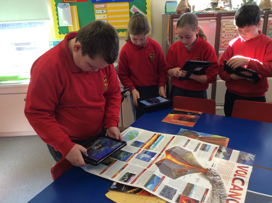 Oliver takes images from natural disasters poster so that he can add these to his iMovie
