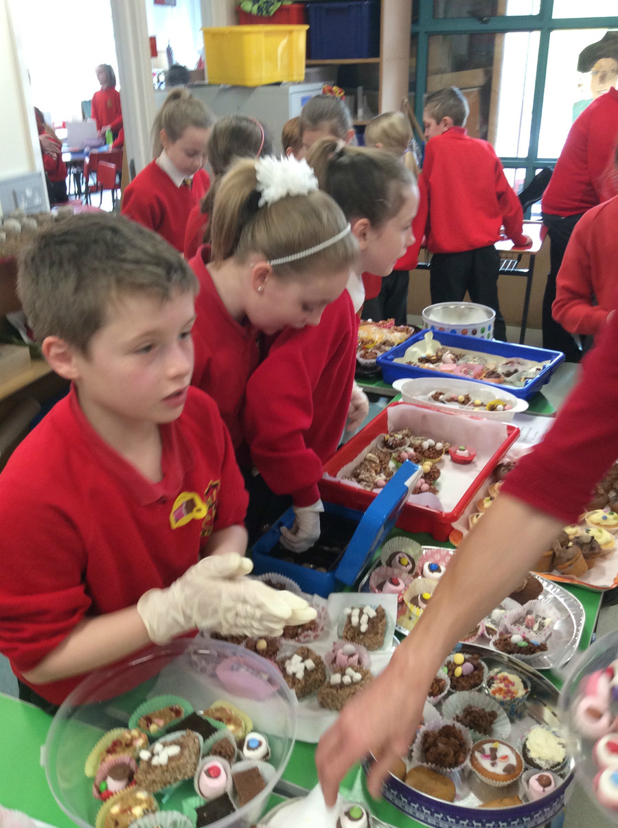 Connor, Holly and Morgan are busy selling in the P.5/6 area.