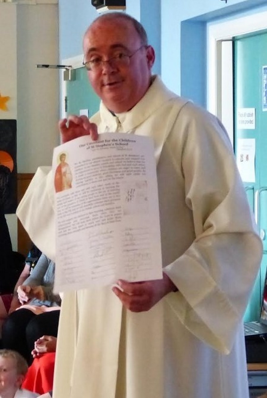 Fr. Andrew with the signed Covenant