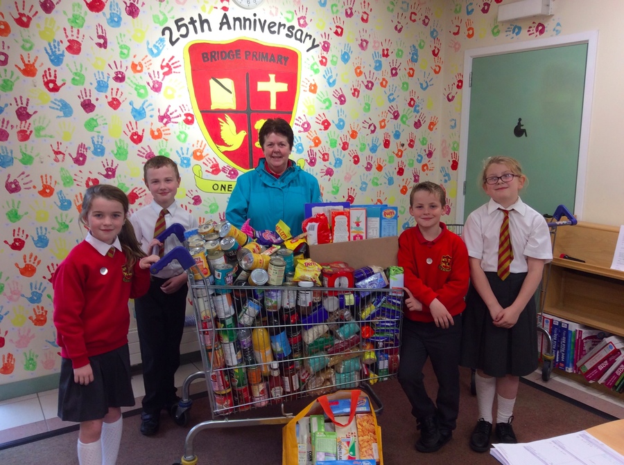 Mrs McClatchy kindly accepts the donated food on behalf of St. Vincent de Paul.