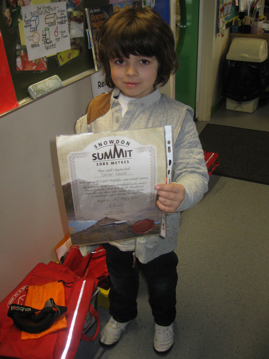 Oliver proudly displays his certificate!